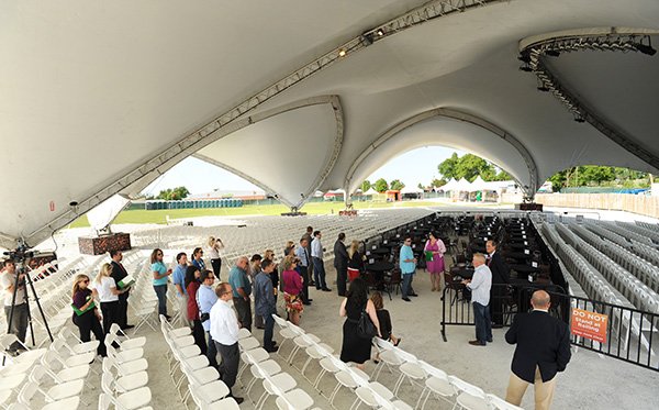 Officials with the Arkansas Music Pavilion lead a tour April 18, 2012, at the facility’s location at the Washington County Fairgrounds in Fayetteville. Walton Arts Center officials, which owns the pavilion, have reportedly settled on a site to move the pavilion to in Rogers. 