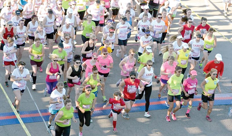 More than 2,000 participants take off at the beginning of the Women Can Run/Walk 5K May 11 through Old Conway,