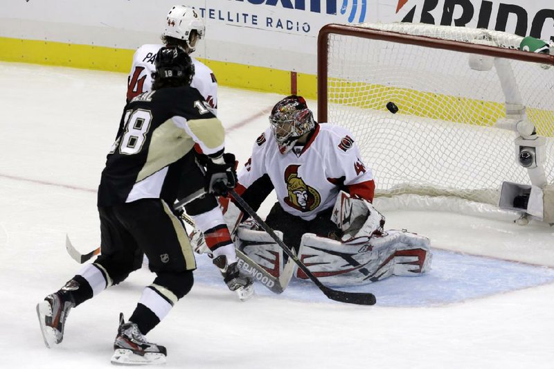 Pittsburgh’s James Neal (18) beats Ottawa’s Jean-Gabriel Pageau and goalie Craig Anderson (right) for his second goal of the game during a 6-2 Penguins’ victory Friday night. Neal scored three goals and led the Penguins to the NHL Eastern Conference finals. 