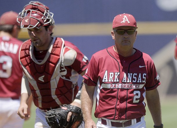 Arkansas coach Dave Van horn heads to the bench after talking with the team in the fourth inning of Saturday's game against LSU at the SEC Tournament in Hoover, Ala. 