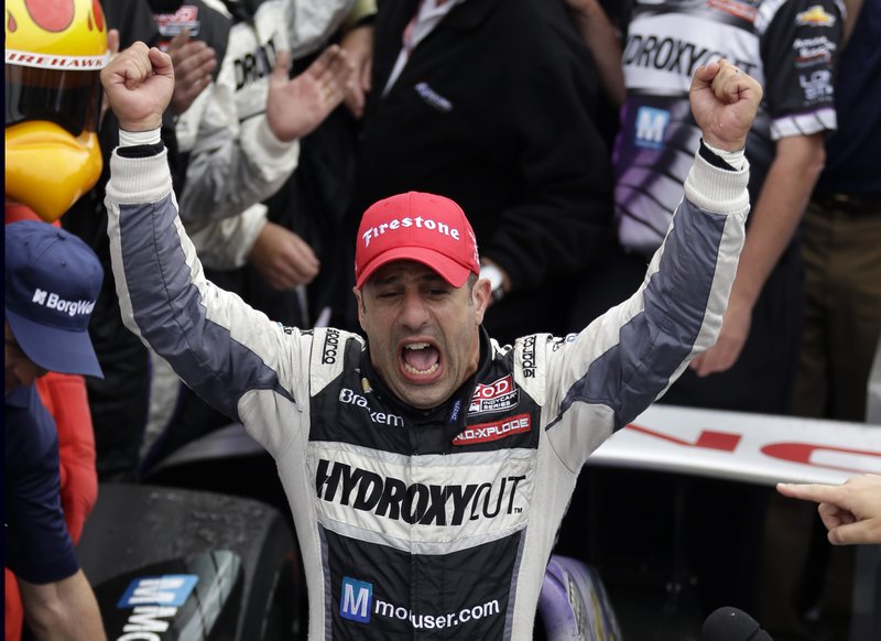 Tony Kanaan, of Brazil, celebrates after winning the Indianapolis 500 auto race at the Indianapolis Motor Speedway in Indianapolis, Sunday.