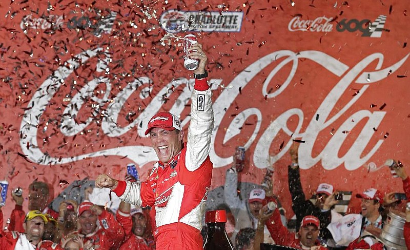 NASCAR Sprint Cup driver Kevin Harvick celebrates in victory lane after winning the Coca-Cola 600 Sunday at Charlotte Motor Speedway in Concord, N.C. 