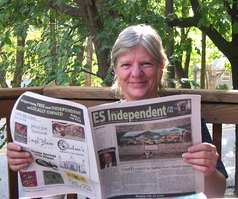 Mary Pat Boian displays the Eureka Springs Independent.