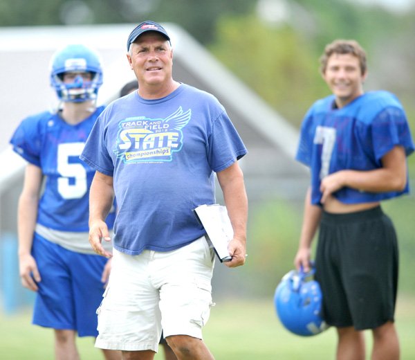 Decatur football coach Shane Holland works with his team last summer in Decatur. 
