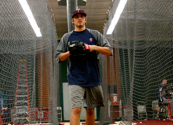 Former Razorback pitcher DJ Baxendale walks betwen the batting cages while training on Wednesday, Jan. 30, 2013, at Baum Stadium in Fayetteville. Baxendale currently plays in the Minnesota Twins organization.