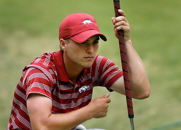 Arkansas senior Austin Cook lines up his putt on the 14th green during the final round of the NCAA men's golf regional on Saturday, May 18, 2013, at The Blessings Golf Club in Fayetteville.