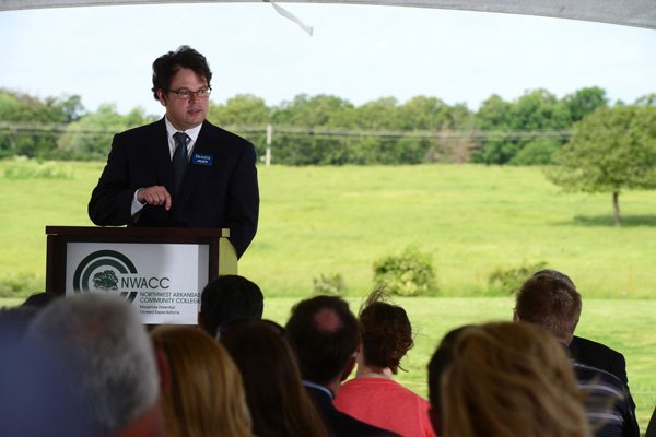 Dennis Smiley, chairman of NorthWest Arkansas Community College’s foundation board, gives a short speech Wednesday at a community celebration at Arvest Ballpark in Springdale. The college wants to build a location on land west of the ballpark. 