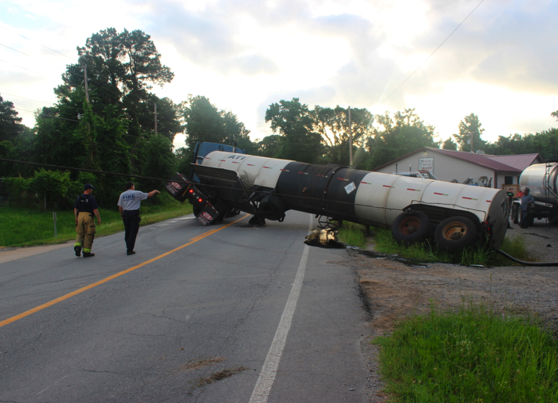 The trailer of an 18-wheeler flipped onto its side and spilled oil Thursday on Dixon Road. 