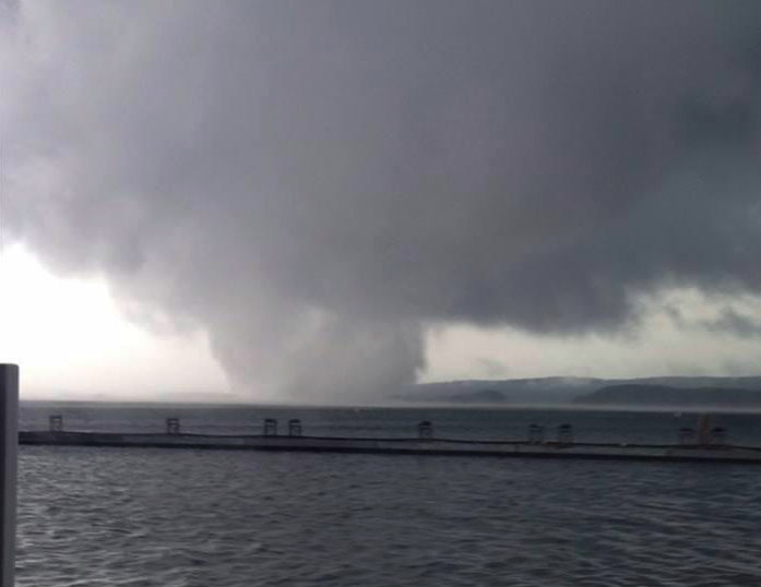 An apparent tornado is pictured Thursday in the Brady Mountain Recreation Area on Lake Ouachita north of Royal, Ark.
