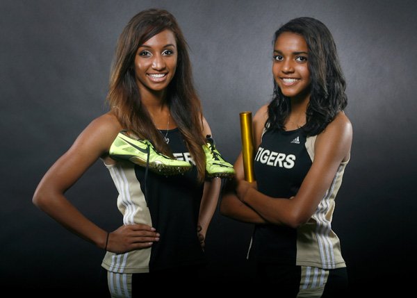 Taylor Mahone, left, and Alexis Rolle of Bentonville are the NWA Media Girls Track Newcomers of the Year. 