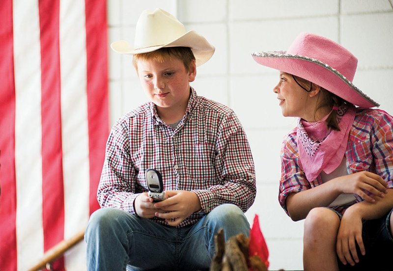 Hunter Newsome, left, and Mary Kate Tipton take part in the play Pecos Bill and the 7 Habits Ranch at Morrilton Elementary School. It was part of a program based on Stephen Covey’s book The Seven Habits of Highly Effective People. The program, The Leader in Me, is designed to teach students leadership skills.