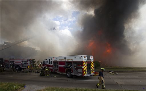 Firefighters battle a fire at the Southwest Inn on Friday in Houston. A fire that engulfed a Houston motel has injured at least six firefighters, including two critically, and three people are missing. 