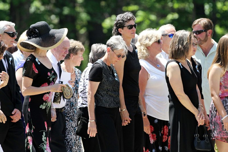 Family and friends arrive for a memorial service for Nancy Lanza on Saturday June 1, 2013 in Kingston, N.H. Lanza’s 20-year-old son, Adam Lanza, killed her at their home in Newtown, Conn., on Dec. 14 and then drove to Sandy Hook Elementary School, where he killed the children and six school employees before committing suicide.