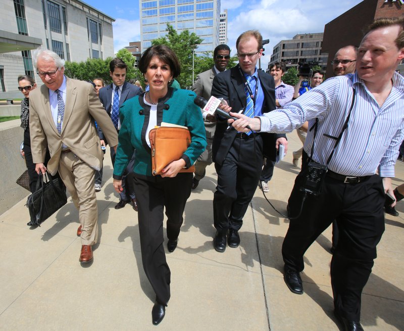 Former state Treasurer Martha Shoffner leaves federal court Friday afternoon with her attorney Chuck Banks (left) after a judge rejected her plea agreement. 