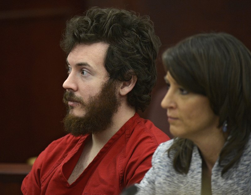 In this March 12 file photo, James Holmes, left, and defense attorney Tamara Brady appear in district court in Centennial, Colo. for his arraignment. Holmes, the suspect in the Colorado theater massacre, could enter his long-expected insanity plea at a hearing Tuesday, though the case could also veer off on another tangent as his lawyers seek the strongest possible defense.