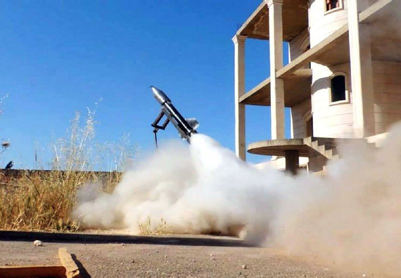 This citizen journalism image provided by Edlib News Network, ENN, which has been authenticated based on its contents and other AP reporting, shows a locally made rocket being fired by Syrian rebels, in Idlib province, northern Syria, Tuesday, June 4, 2013. The Syrian government has denied it is facing a popular uprising since the revolt against Assad's rule erupted in March 2011, saying that the army is fighting foreign-backed terrorists who want to destroy the country. (AP Photo/Edlib News Network ENN)