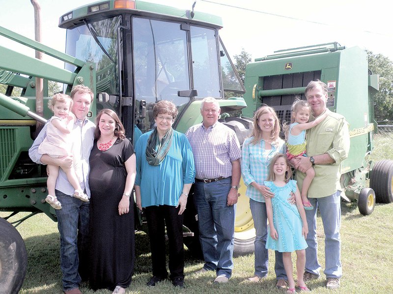 The Gary Rowlands family of Russellville, whose farm is in Hector, is the 2013 Pope County Farm Family of the Year. Family members are, from the left, Scott Jackson and Rebecca Rowlands Jackson with their 2 1/2-year-old daughter, Anna, of Fayetteville; Willette and Gary Rowlands; and Kristen Rowlands Minton and her husband, Dr. Randy Minton, with their two daughters, Ella Minton, 3, and Addy Minton (front), 6, of Little Rock. Rebecca gave birth to her and Scott’s second daughter, Charlotte Grace, on May 29.
