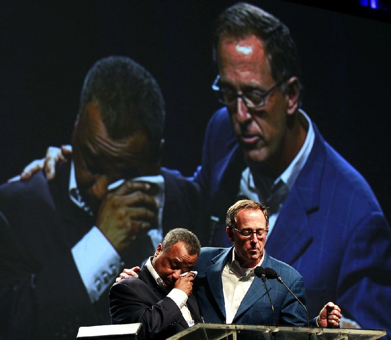 The Rev. Fred Luter wipes away tears as the Rev. Bryant Wright announces his election as the first black president of the Southern Baptist Convention last year in New Orleans. Luter’s term ends during next week’s convention in Houston but he is widely expected to be re-elected for a second year. 