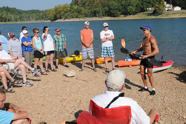 Olympic kayak paddler Mike Herbert of Rogers, right, gives his basic kayaking seminar in June 2012 at Beaver Lake. This year's seminar is set for June 22 at Prairie Creek park. 