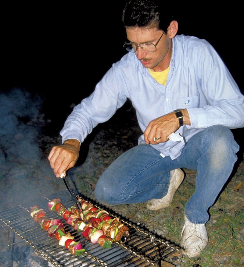 Kabobs, steaks, chicken and other meats can be cooked directly on a folding grill set securely above campfire coals.