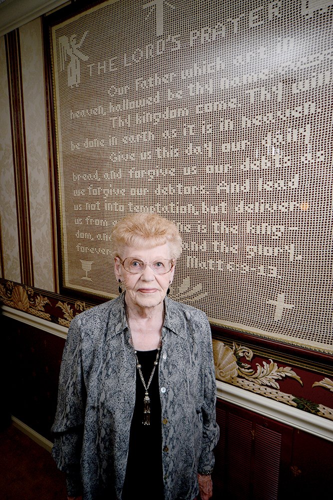 Jonnie Fuller, 92, of Conway stands in front of The Lord’s Prayer, one of the many pieces she has crocheted. She said it’s the only one like it in the world because she took graph paper and made the pattern. “It weighs 84 pounds,” she said. Named after an uncle, Fuller worked for the Pentagon for years and competed in and won dance contests as a senior citizen.