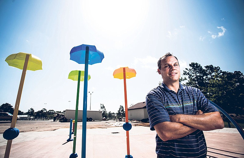  John Eckart, Benton Parks and Recreation director, is shown in front of the Splashpad, a zero-depth water play area set to open soon at Tyndall Park in Benton.