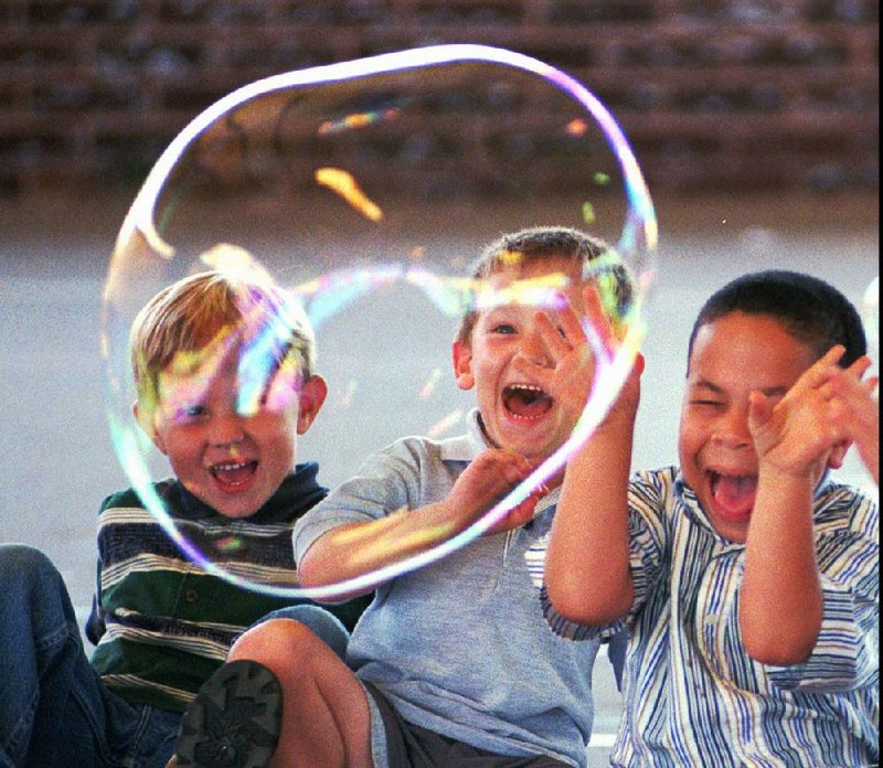 Kids Summer Science Kamp campers at The Jones Center in Springdale react in horror at an experiment that created a small humidity pod. The terrifying real swarm is due to begin next week. 