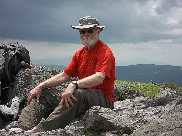 Doug Nelson rests atop a mountain in Virginia while hiking the Appalachian Trail. 