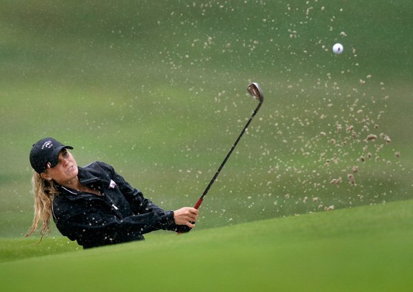 Emma Lavy hits out of the sand onto the sixth green Monday during the qualifier round for the Walmart NW Arkansas Championship at Pinnacle Country Club in Rogers.