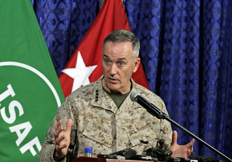 Top U.S. military commander in Afghanistan, Joseph Dunford, talks to media representatives at the ISAF headquarters in Kabul, Afghanistan, Tuesday, June, 18, 2013. Dunford said NATO will support any positive movement to bring reconciliation between the Afghan people and Taliban. American officials say U.S. representatives will begin formal meetings with the Taliban in a few days at the group's new office opening in Qatar. 