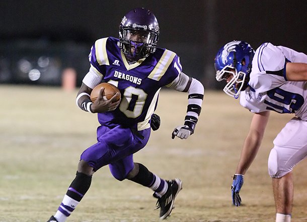 Junction City quarterback Shaquille Hunter (10) runs out of the backfield against Dierks during the first half of the second round 2A state playoffs at Paul Muse Field in Junction City on Friday, Nov. 16, 2012. 