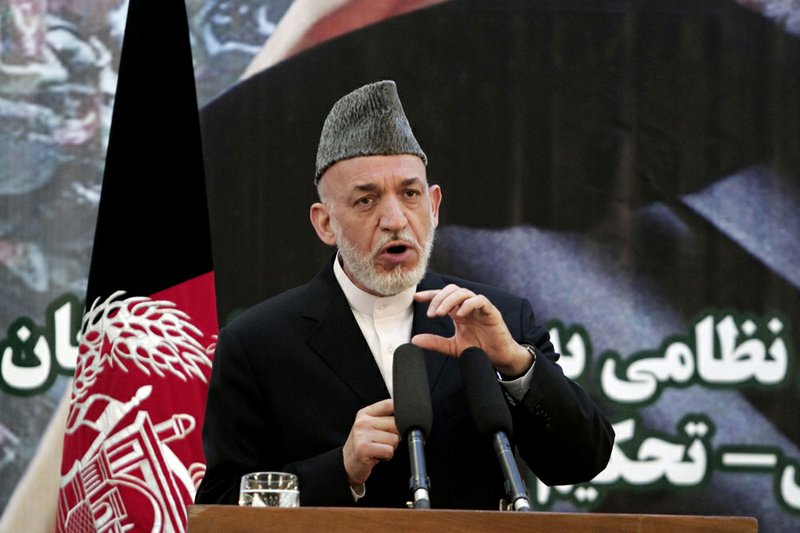 Afghan President Hamid Karzai speaks during a ceremony at a military academy on the outskirts of Kabul, Afghanistan, on Tuesday, June 18, 2013. 