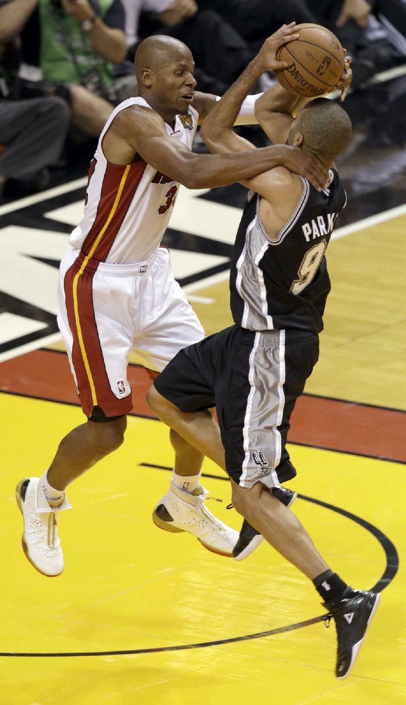 Miami’s Ray Allen (left) sank a game-tying three-pointer in the fi nal seconds of regulation Tuesday against San Antonio, setting up the Heat’s 103-100 overtime victory. Allen knows what it is like to play Game 7 in the NBA Finals. 
