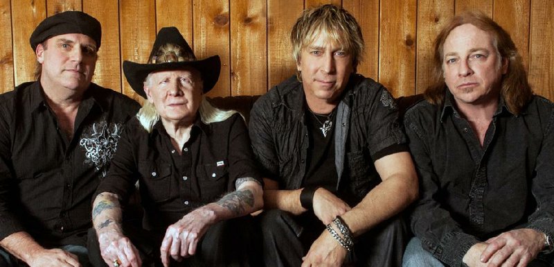 Johnny Winter (in cowboy hat) will perform with his band — (from left) Scott Spray, Paul Nelson and Tommy Curiale — at Juanita’s Friday. 