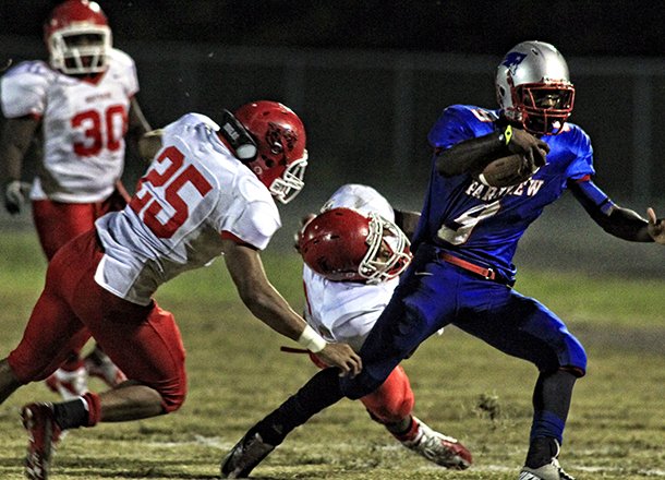 Fort Smith Northside defender Daytrieon Dean (25) attempts a tackle against Little Rock Parkview's Caelon Harden during a 2012 game.