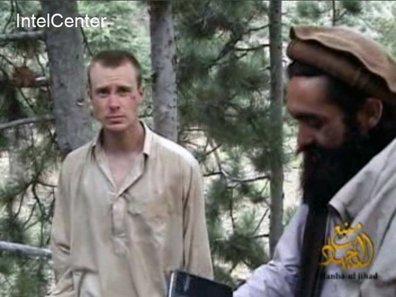 This file image provided by IntelCenter in 2010 shows a frame grab from a Taliban video purportedly depicting U.S. Army Sgt. Bowe Bergdahl (left). Taliban spokesman Shaheen Suhail said Thursday that the Taliban are ready to hand over Bergdahl, held since 2009, in exchange for five senior operatives detained at Guantanamo Bay,Cuba. 