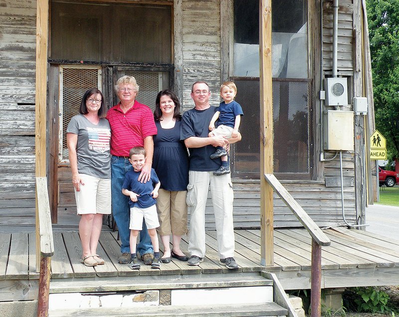 The Parmer Lee Hankins Sr. family of Oil Trough is the 2013 Independence County Farm Family of the Year. Family members include, from the left, Lucinda and Parmer Hankins; their daughter-in-law, Kendra Hankins; their son, Parmer “Lee” Hankins Jr.; and their grandsons, Christian, 5, standing, and Joshua, 2, being held by his father. Not shown are the Hankinses’ younger son, Phillip Tyson Hankins, and his wife, Janie, who live in Fayetteville.