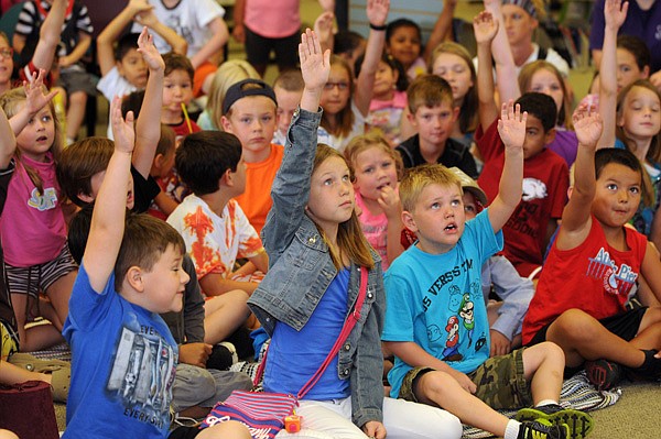 Kids volunteer Thursday to be performers for the story of Simple Ivan at the Springdale Public Library. 