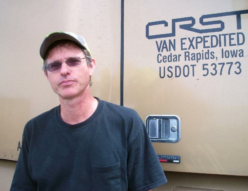 CRST driver Jonathan West of Bradenton Fla., who was having lunch at a truckstop near Fort Smith. He says the new "hours of service" rules may interfere with his getting rest when he actually needs it.  Photo by Lisa Hammersly.
