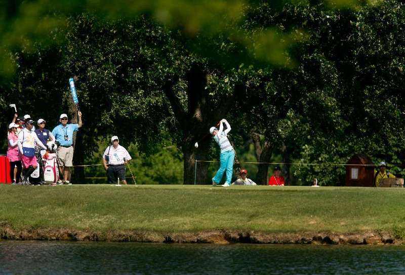 NWA Media/JASON IVESTER
Mika Miyazato hits from the eighth tee on Friday, June 21, 2013, during the first round of the Walmart NW Arkansas Championship Pinnacle Country Club in Rogers.