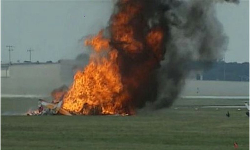 This photo shows a plane after it crashed Saturday, June 22, 2013, at the Vectren Air Show near Dayton, Ohio. The pilot and a wing walker were killed instantly.
