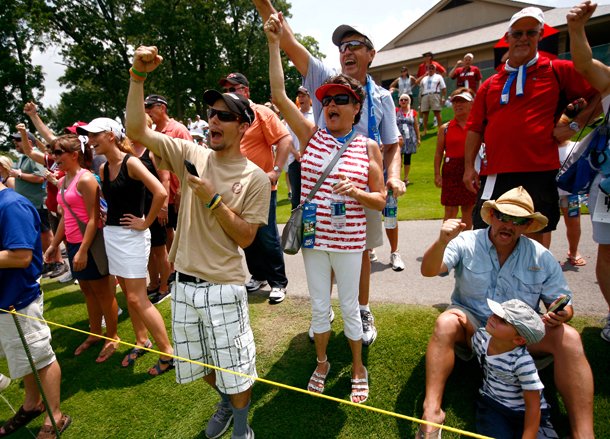 Fans call the Hogs as Stacy Lewis approaches the green on Saturday, June 22, 2013, during the second round of the Walmart NW Arkansas Championship at Pinnacle Country Club in Rogers.