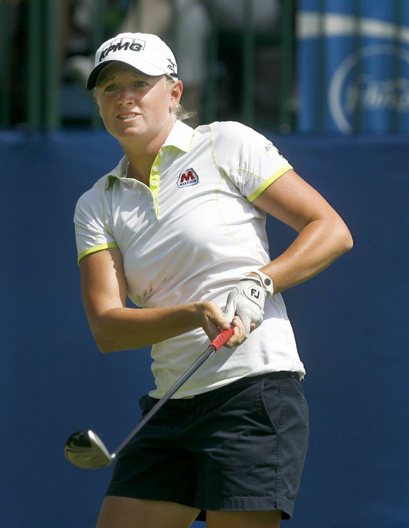 Stacy Lewis, the four-time Arkansas All-American, parlayed four early birdies into a 6-under-par 65 and is in a four-way tie for the lead at the LPGA Wal-Mart Northwest Arkansas Championship after 36 holes, even after ending her round with a three-putt bogey. 