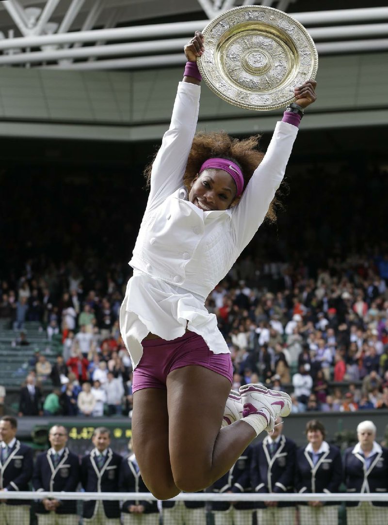 Serena Williams celebrates after defeating Agnieszka Radwanska to win the women’s final at Wimbledon last summer. When this year’s tournament starts Monday, Williams will be on a 31-match winning streak and an overwhelming favorite to win her second consecutive title. 