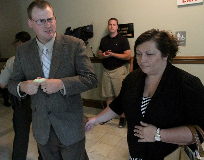 Arkansas Democrat-Gazette/BENJAMIN KRAIN --6/22/13-- 
Former Little Rock police officer Josh Hastings awaits a jury decision Saturday morning with his wife Kim during his manslaughter trial at the Pulaski County Courthouse in Little Rock.