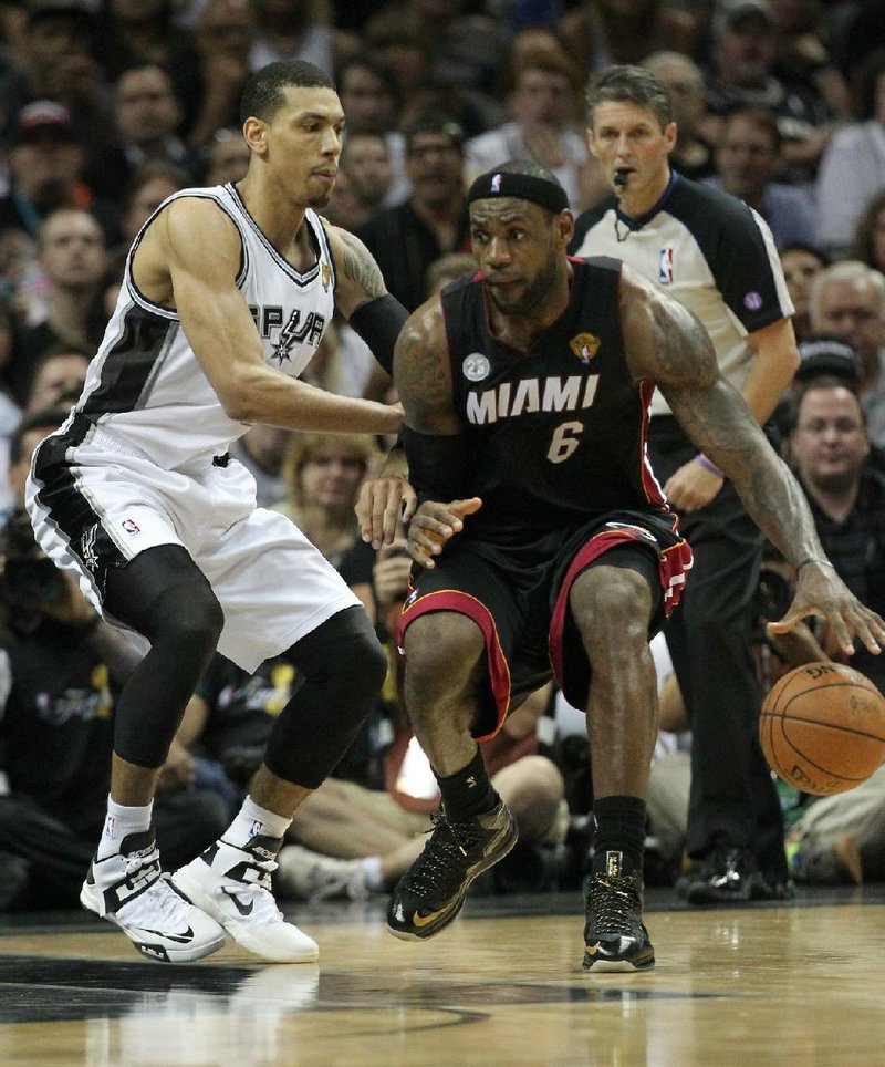 LeBron James’ Miami Heat (right) beat Danny Green’s San Antonio Spurs in seven games of the NBA Finals. 