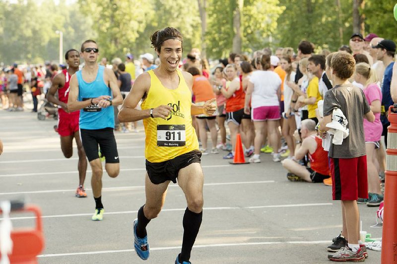 Ari Perez, 25, traveled from Dallas to place 10th overall in the Go! Mile, running the mile against other elite men in 4 minutes, 37.86 seconds, fourth among men 25-29 on June 15 in North Little Rock’s Burns Park. Photographer Angie Davis has a gallery of photos from the race at arkansasonline.com/galleries. 