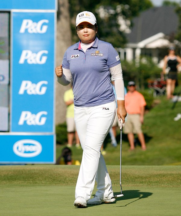 Inbee Park celebrates after sinking a birdie putt on the 18th green on Sunday during the third round of the Walmart NW Arkansas Championship at Pinnacle Country Club in Rogers. Park defeated So Yeon Ryu in a playoff to win the tournament. 
