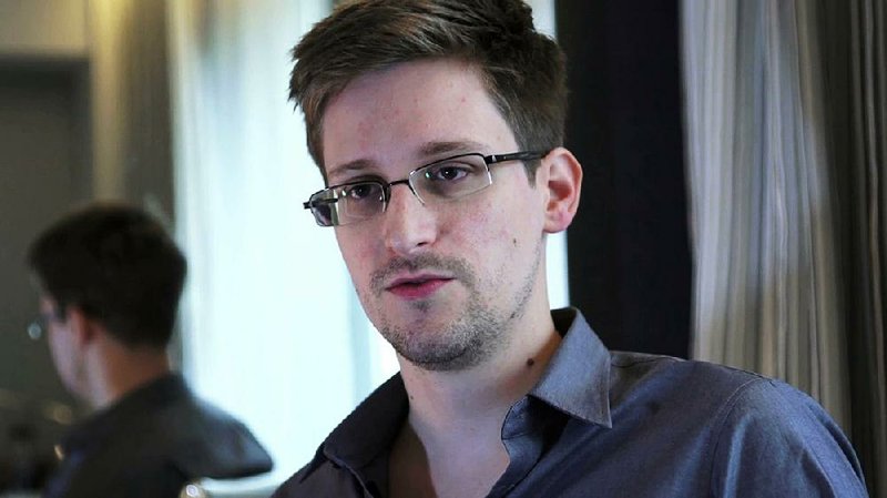 This photo provided by The Guardian Newspaper in London shows Edward Snowden, who worked as a contract employee at the National Security Agency, on Sunday, June 9, 2013, in Hong Kong. The Guardian identified Snowden as a source for its reports on intelligence programs after he asked the newspaper to do so on Sunday. (AP Photo/The Guardian)
