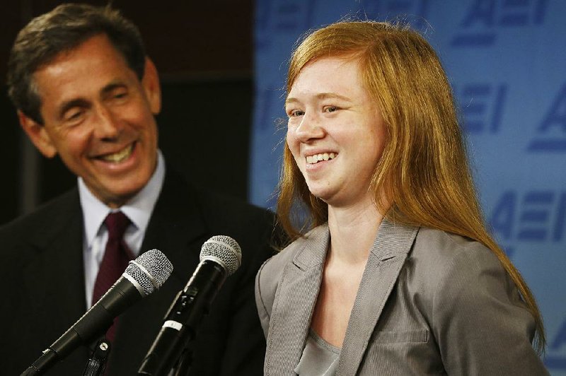 Abigail Noel Fisher, who sued the University of Texas when she was not offered a spot at the university’s flagship Austin campus in 2008, with Edward Blum of the Project on Fair Representation, speaks at a news conference at the American Enterprise Institute in Washington on Monday. 